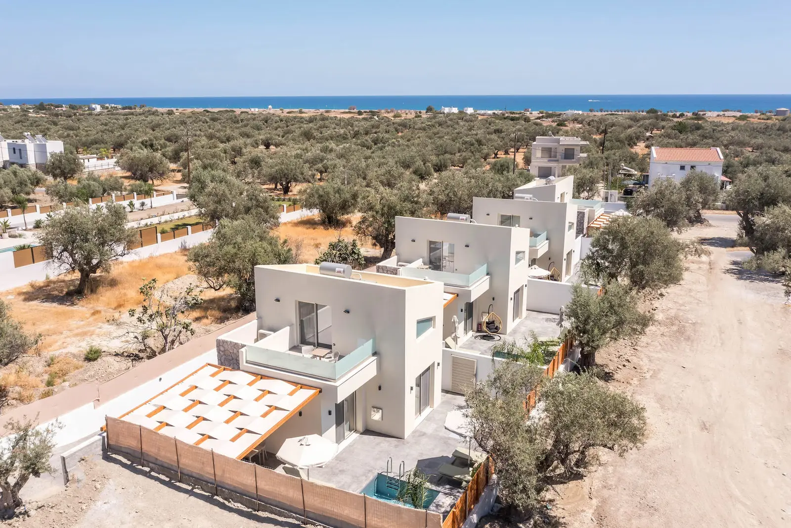 Aerial view of the four Aura villas