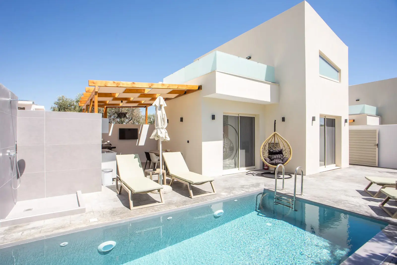 Pool terrace with sunbeds
